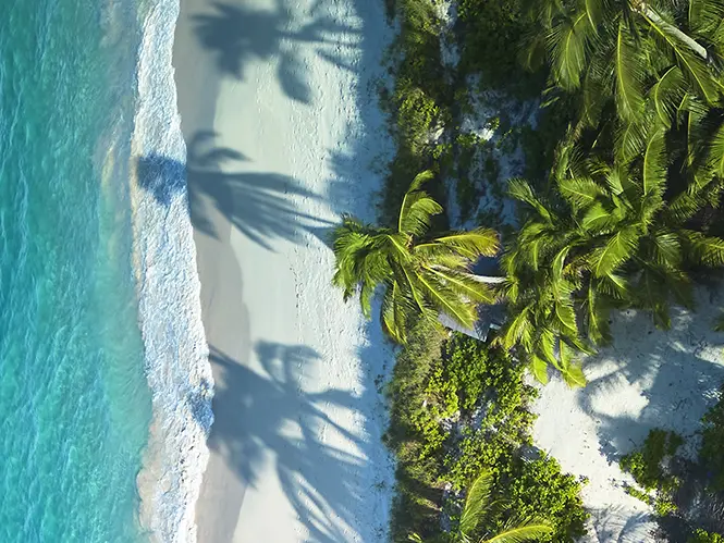 Shadows fall over the Potlatch beach as the sun goes down at The Potlatch Club Eleuthera