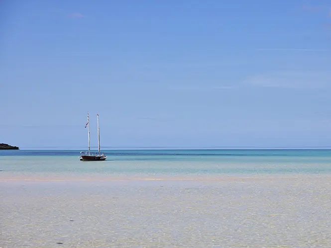 Caribbean beaches with sailing boat on the leeward shores of Eleuthera