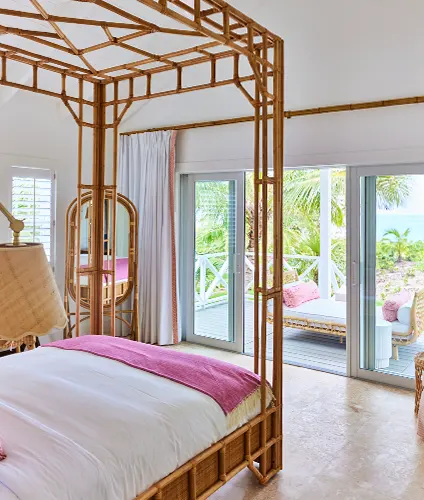 Pink Sand House, i-bedroom villa at The Potlatch Club, Eleuthera, rattan four poster bed